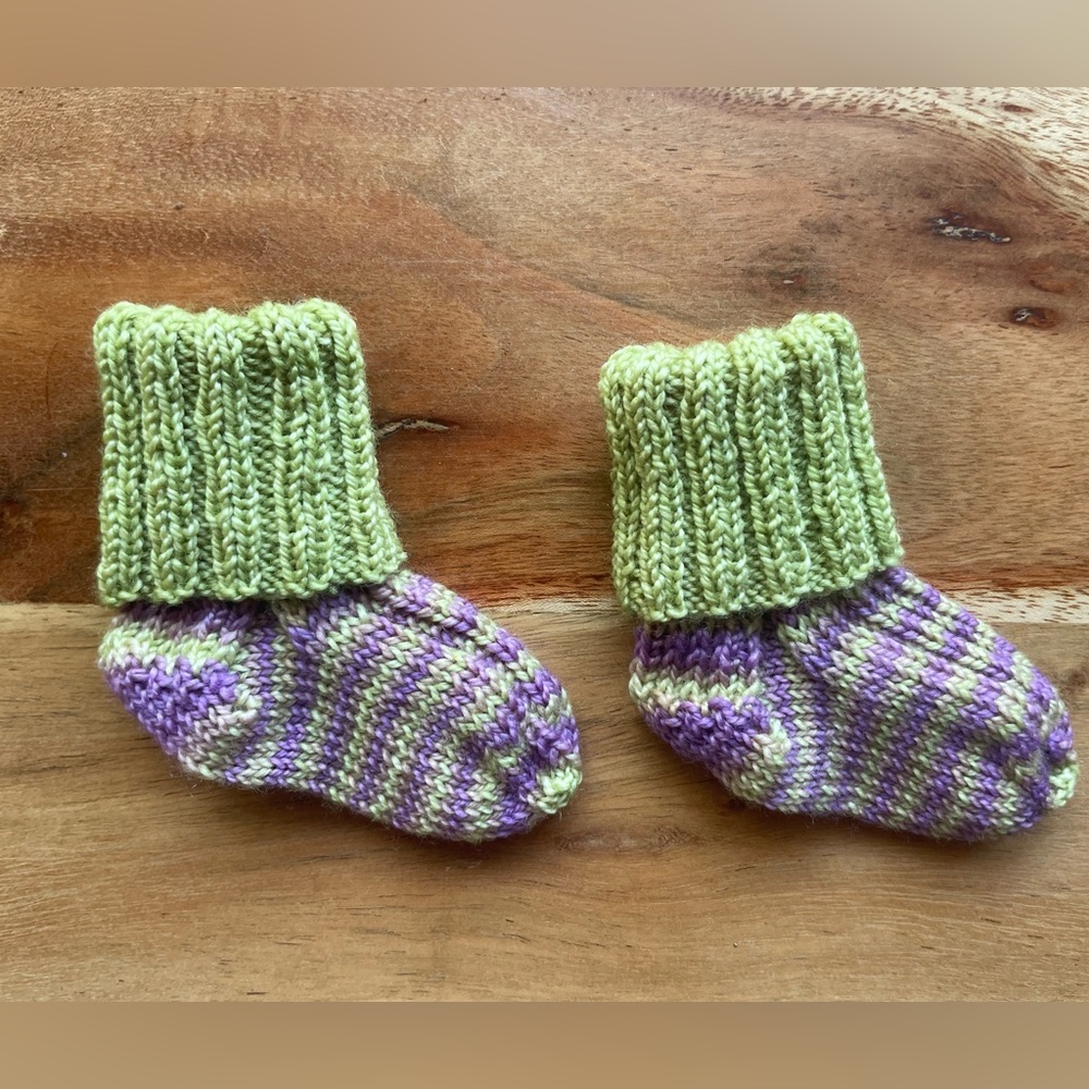 Last chance! 
Hand knit Baby Socks—that will actually stay on your baby’s feet!